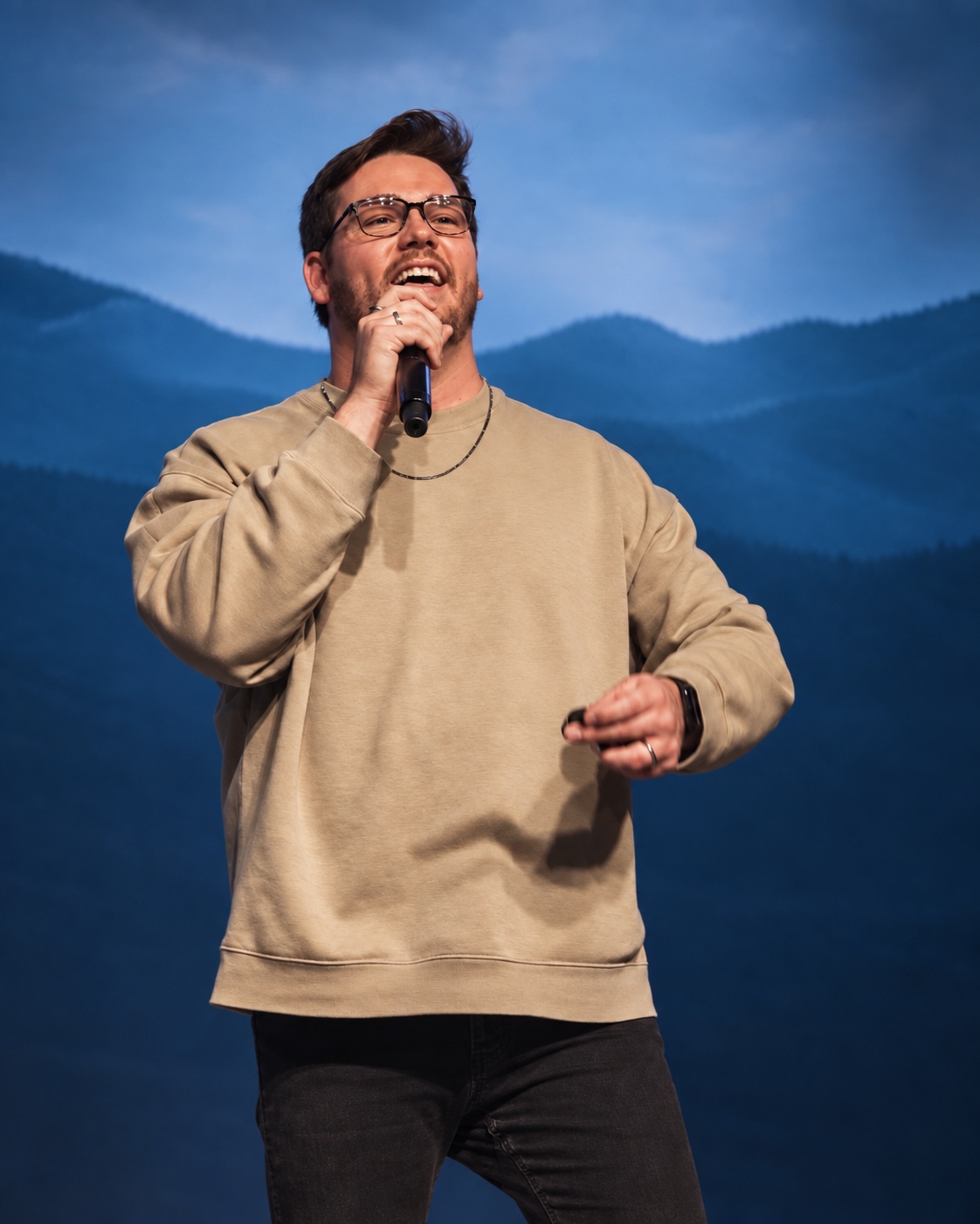 Dylan Wilkin speaking on stage