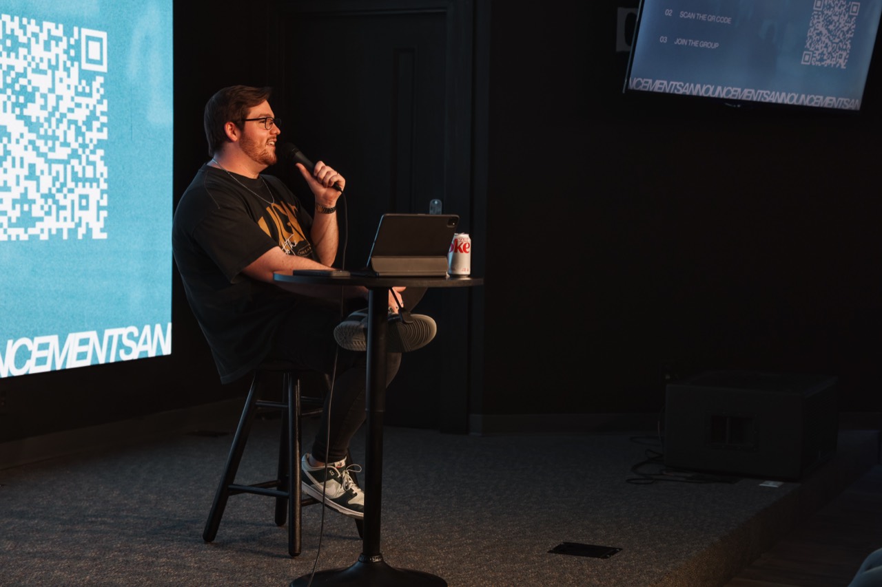 Dylan teaching from a stage